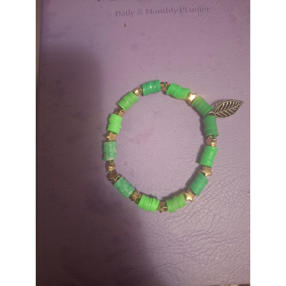 Green Heishi Bead Stretch Bracelet with Gold Star Spacers and Leaf Charm Boho